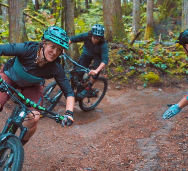 Two riders practicing their cornering skills during a mountain bike cornering clinic in Squamish