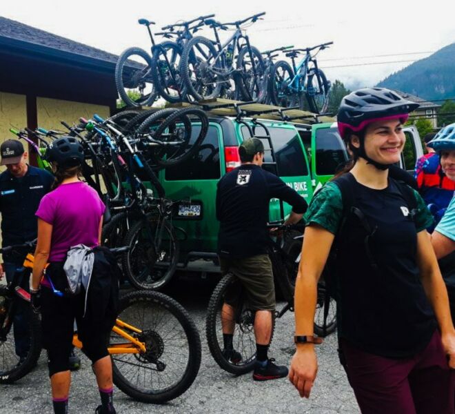 A large group is loading up and getting ready for an epic day of mountain biking with our guides