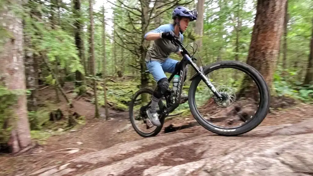Jo&Co x RideHub Squamish Shuttle Clinic 2 A rider going up a punchy section of trail in Squamish using the skills from our mountain bike climbing lessons