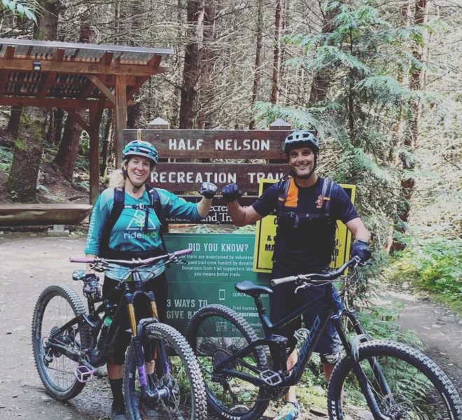 A rider and their mountain bike guide at the top of the Half Nelson recreation trail in Squamish