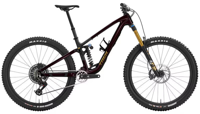 A full-suspension mountain bike with a dark frame, coil shock, dropper seatpost, and Maxxis tires, shown in a side profile on a white background.